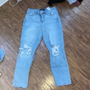 hollister mom jeans light blue with rips on knees.